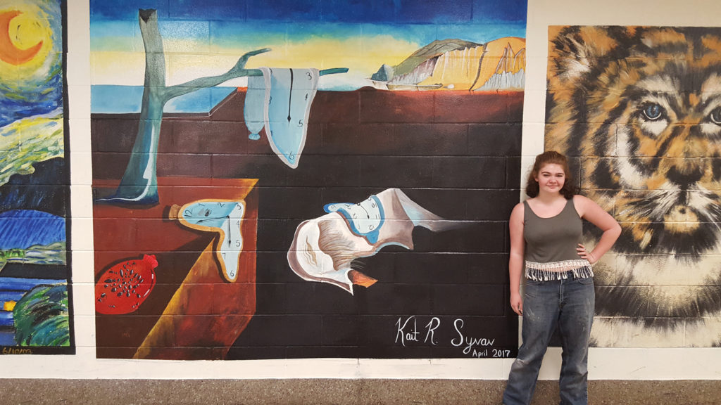 Kaitlyn with her Mural at CHS