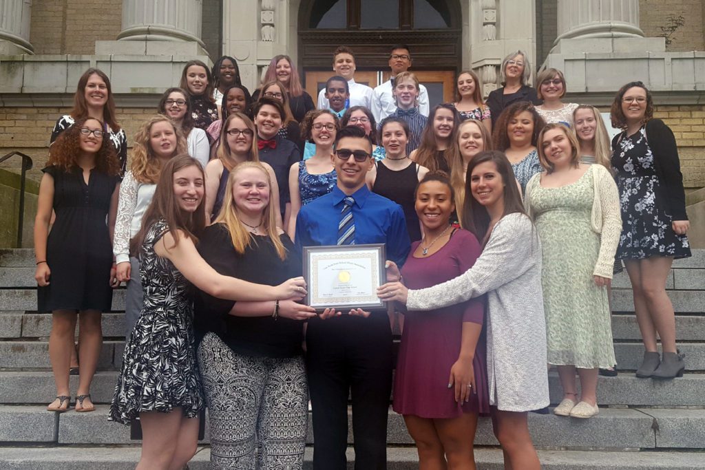 Concert Chorus with their Gold certificate on the steps of Kingston High School