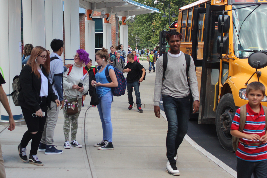 high school students head to the bus