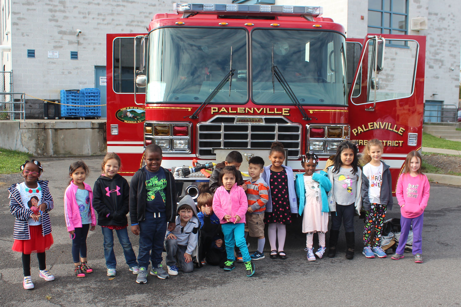 Kindergartners pose with fire truck