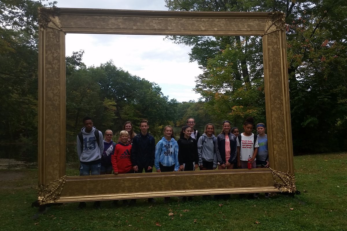 student pose in giant frame