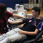 Tristan McEwan donates blood