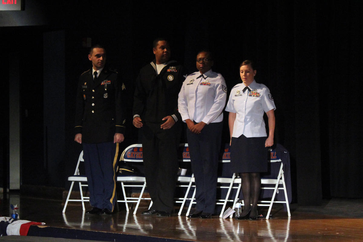 active duty servicemen and women on stage at CHS