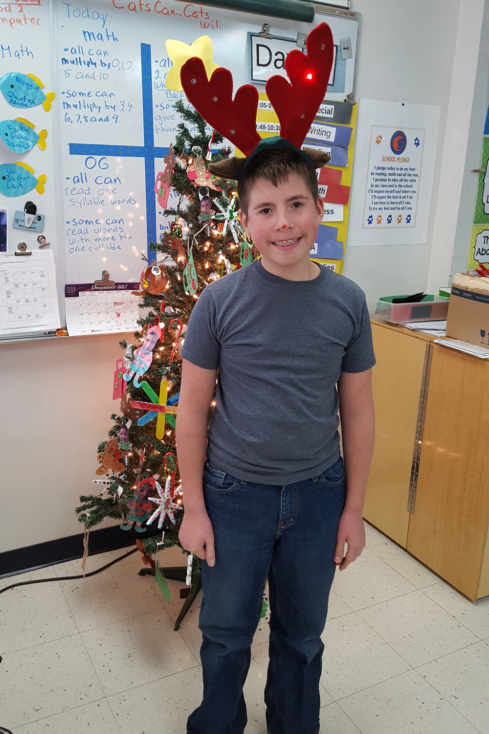 student with antlers
