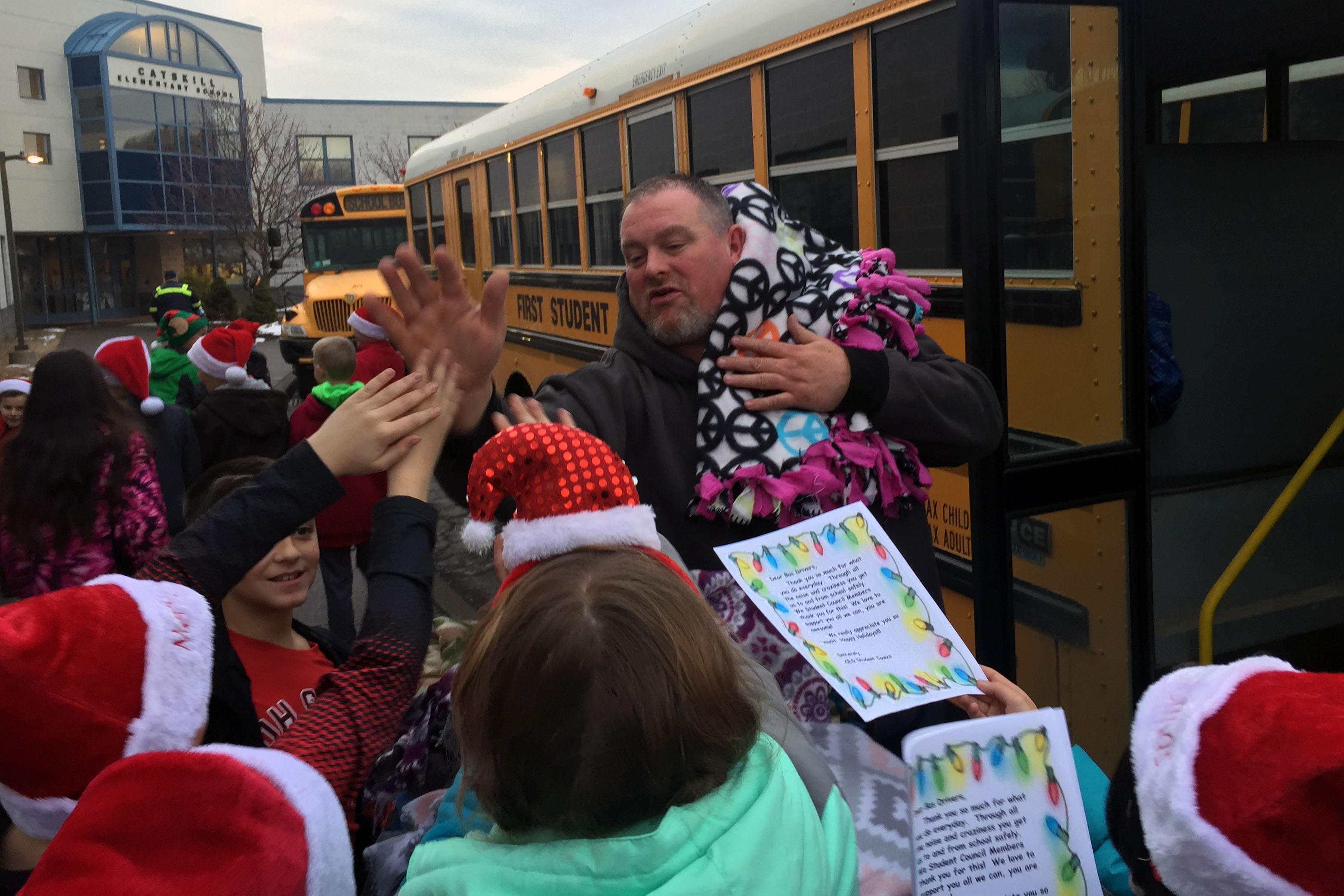 bus driver high-fives students