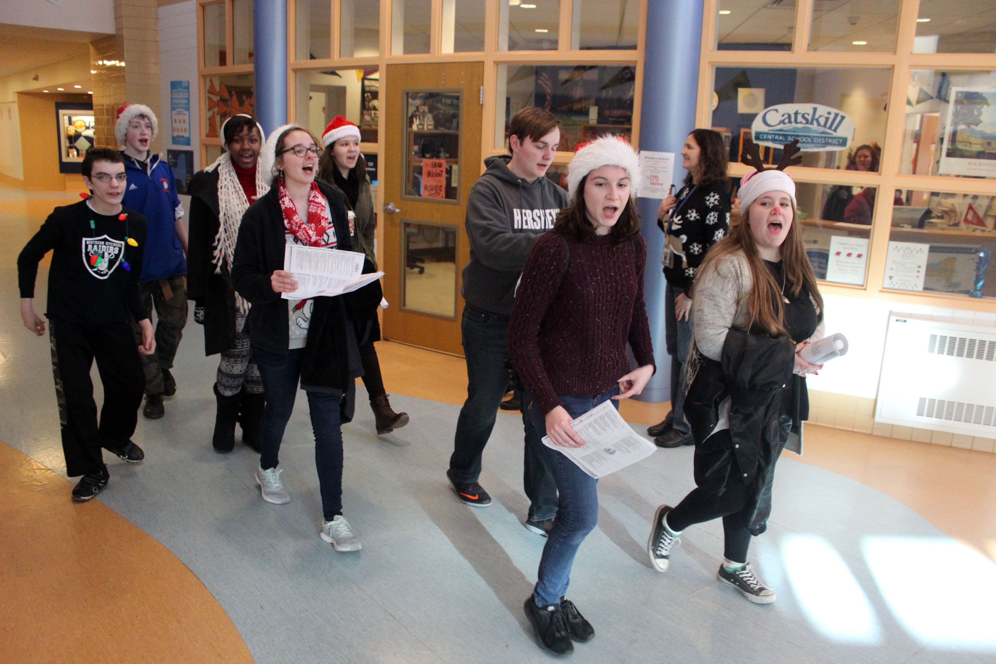 Carolers sing in the halls of CHS