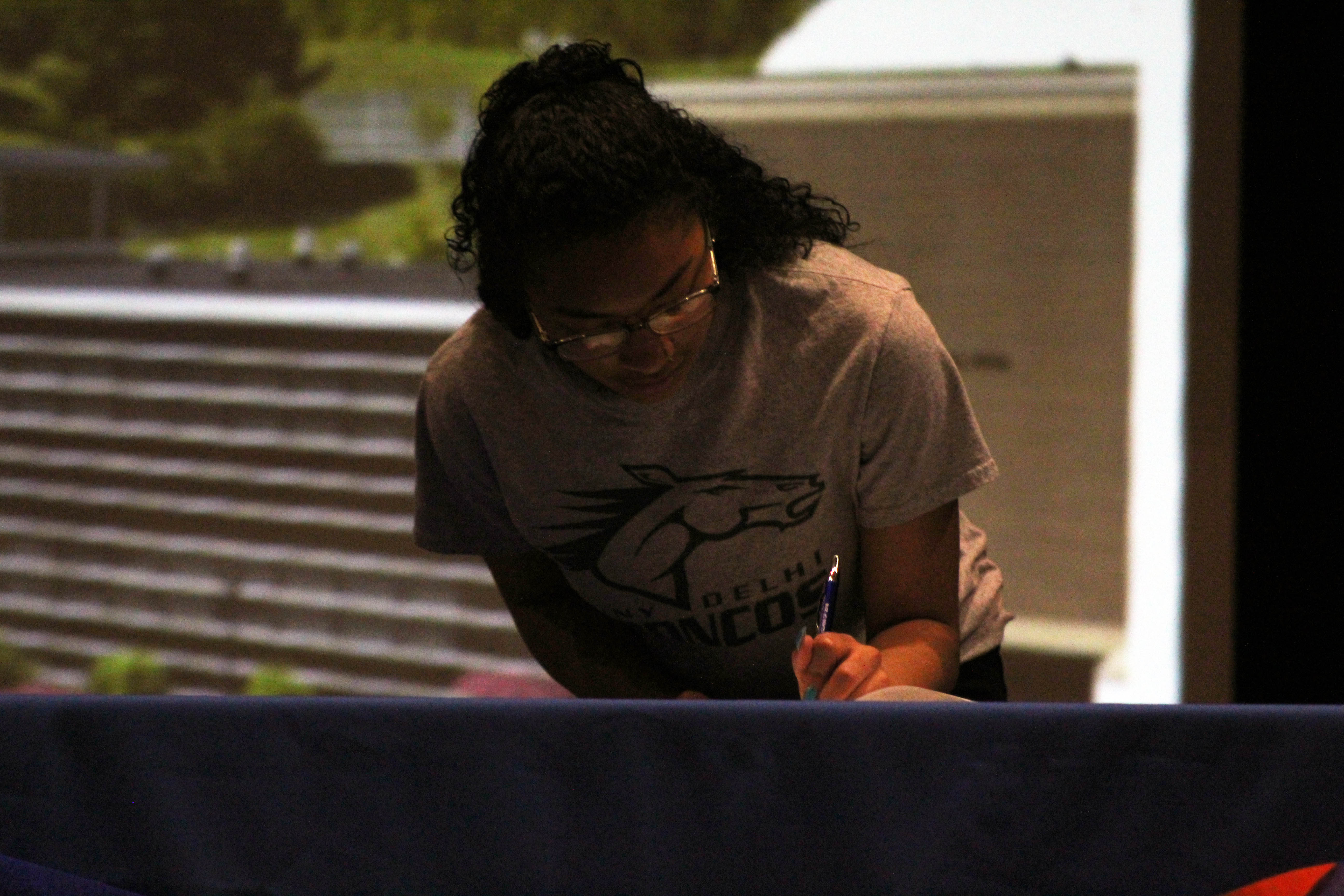 girls signing on senior signing day