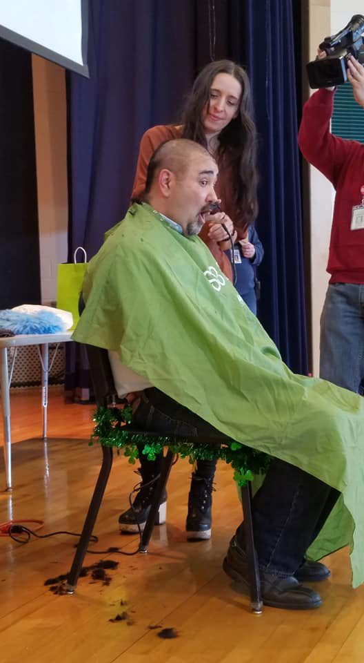 Mr. Rivers has his head shaved by Chris Mercan