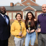 Dr. Cook, reporters Mya Hernandez and Lexi Davies, and media teacher Patrick Hernandez with their awards