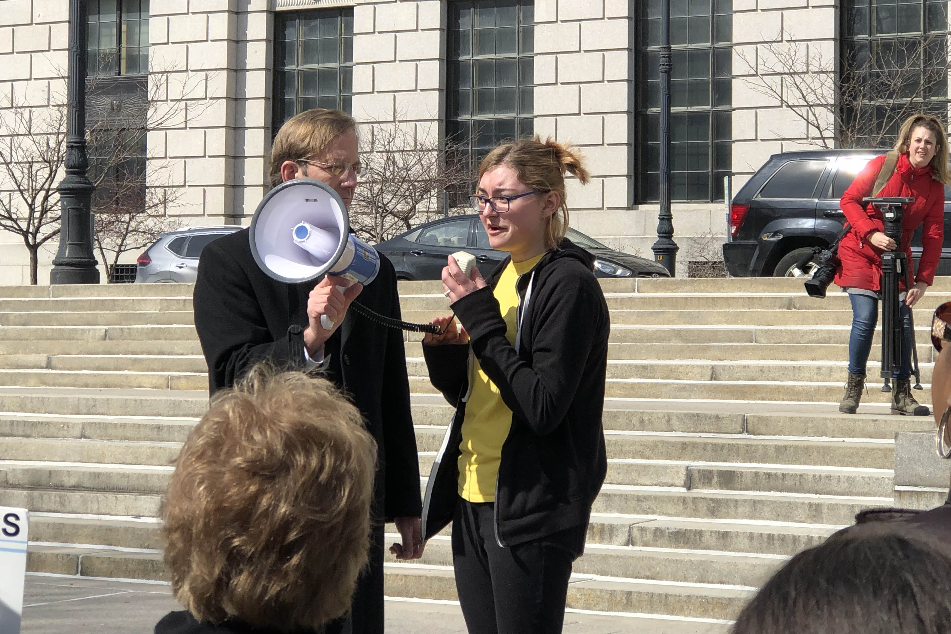 student speaking into a bullhorn