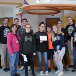 Catskills top finishers and math facuty pose for picture in High School lobby