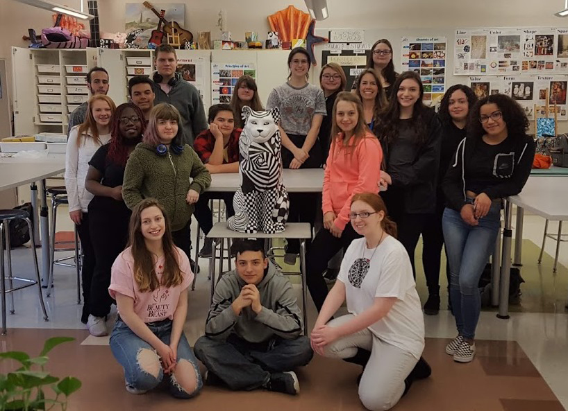 Students pose with finished cat