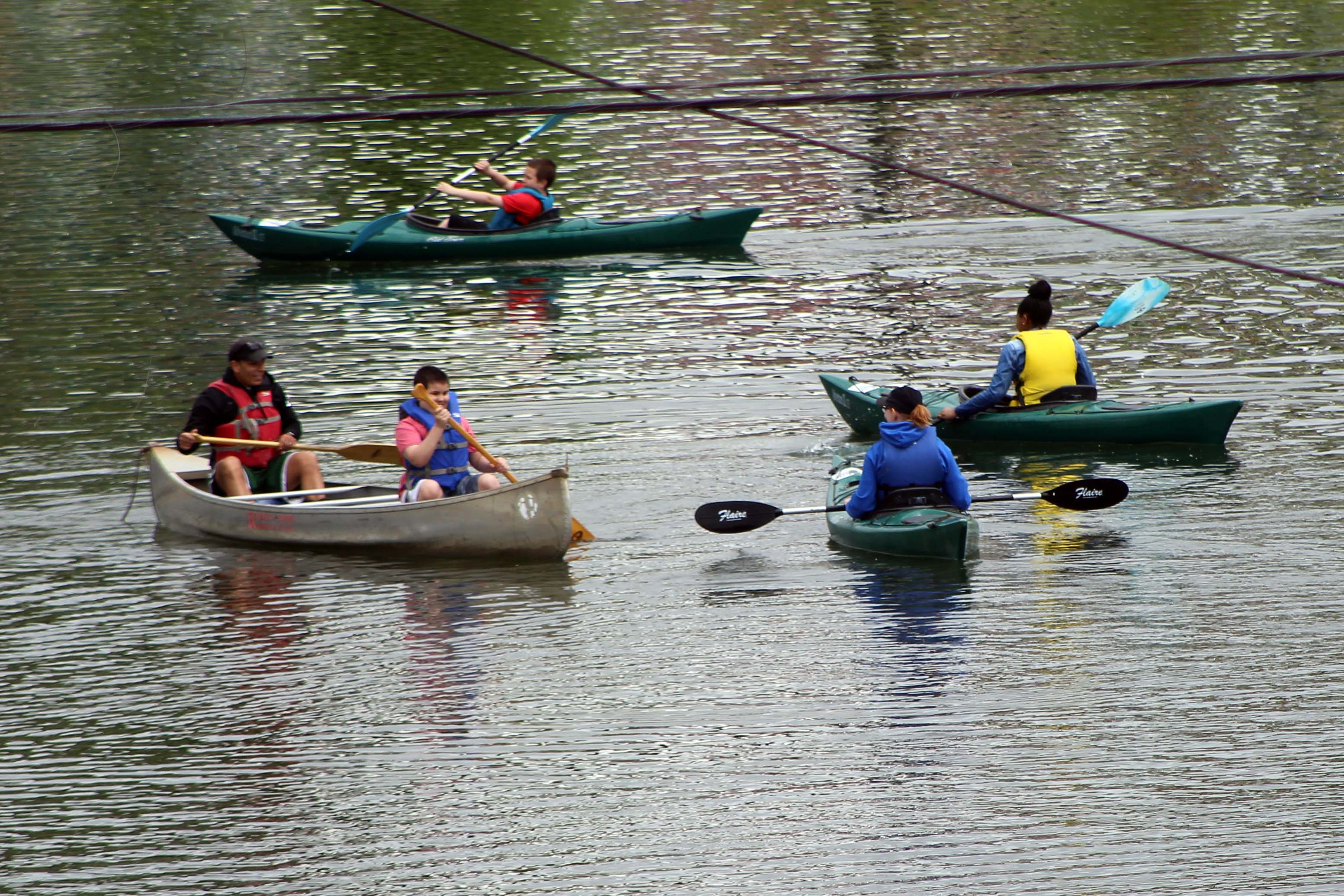 group of student paddling on the water