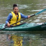 girl paddling kayak