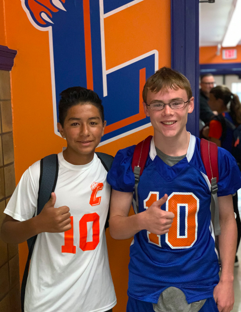 two boys wearing Catskill athletic shirts