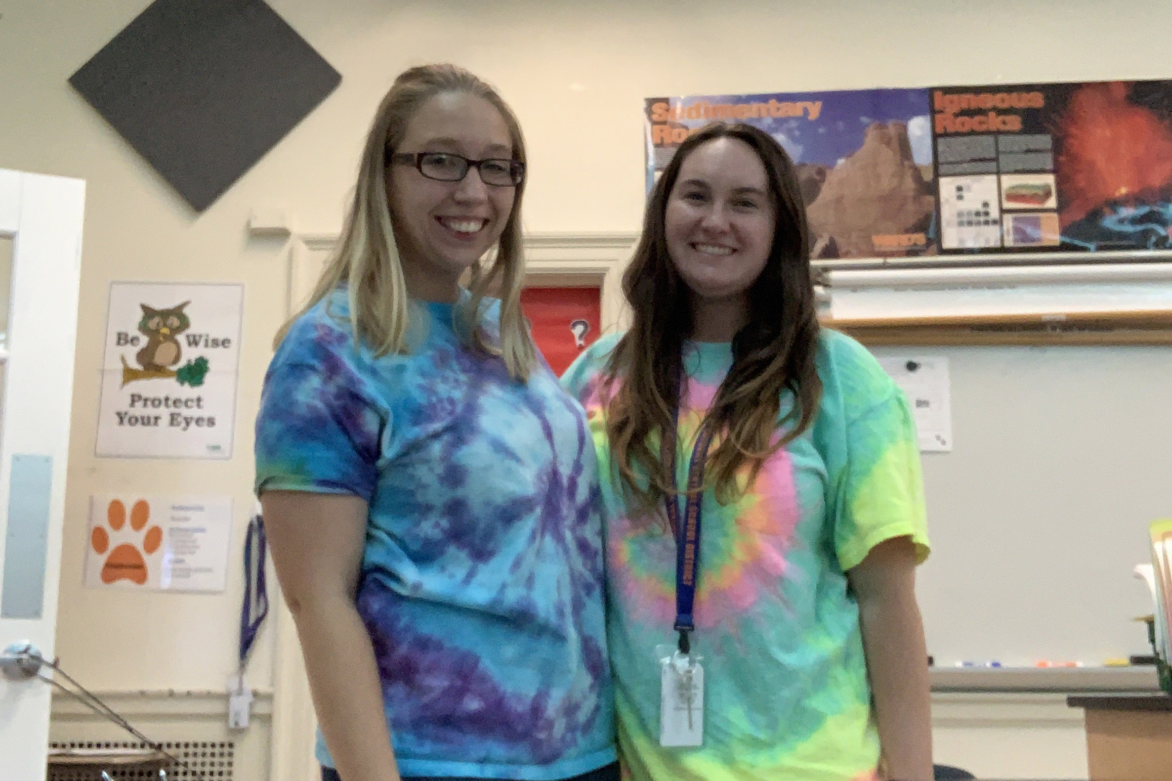 two women wearing tie-dye shirts