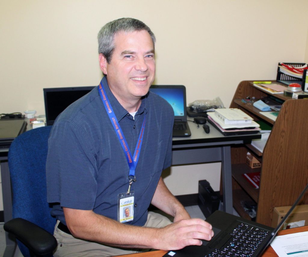 Don Marino sitting at computer