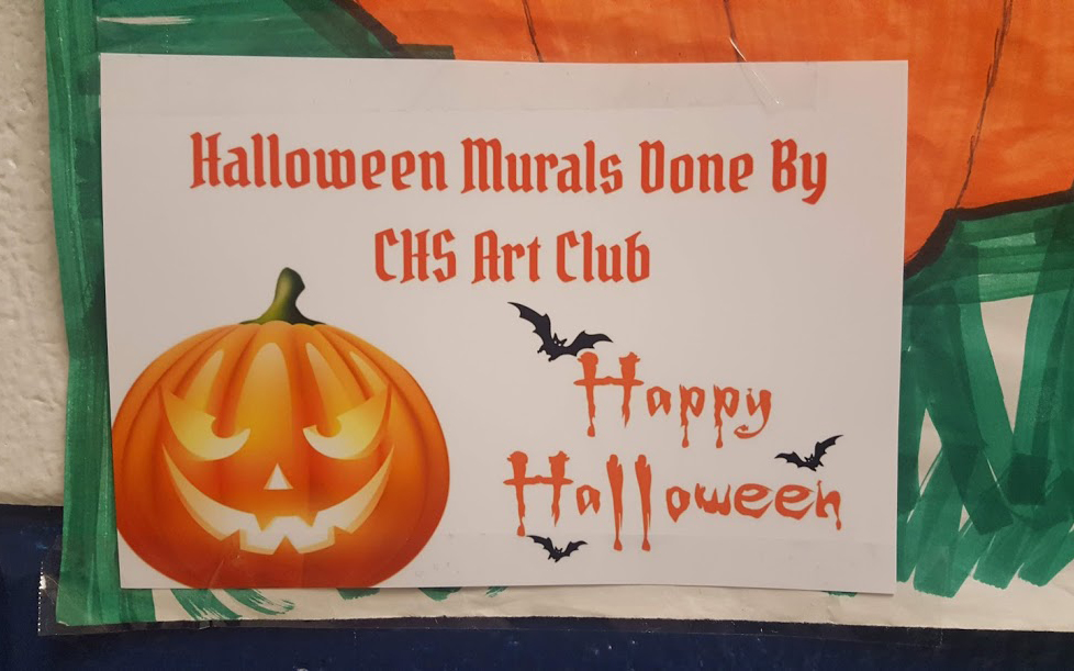 sign showing pumpkin, bas, and the words Halloween Murals Done By CHS Art Club