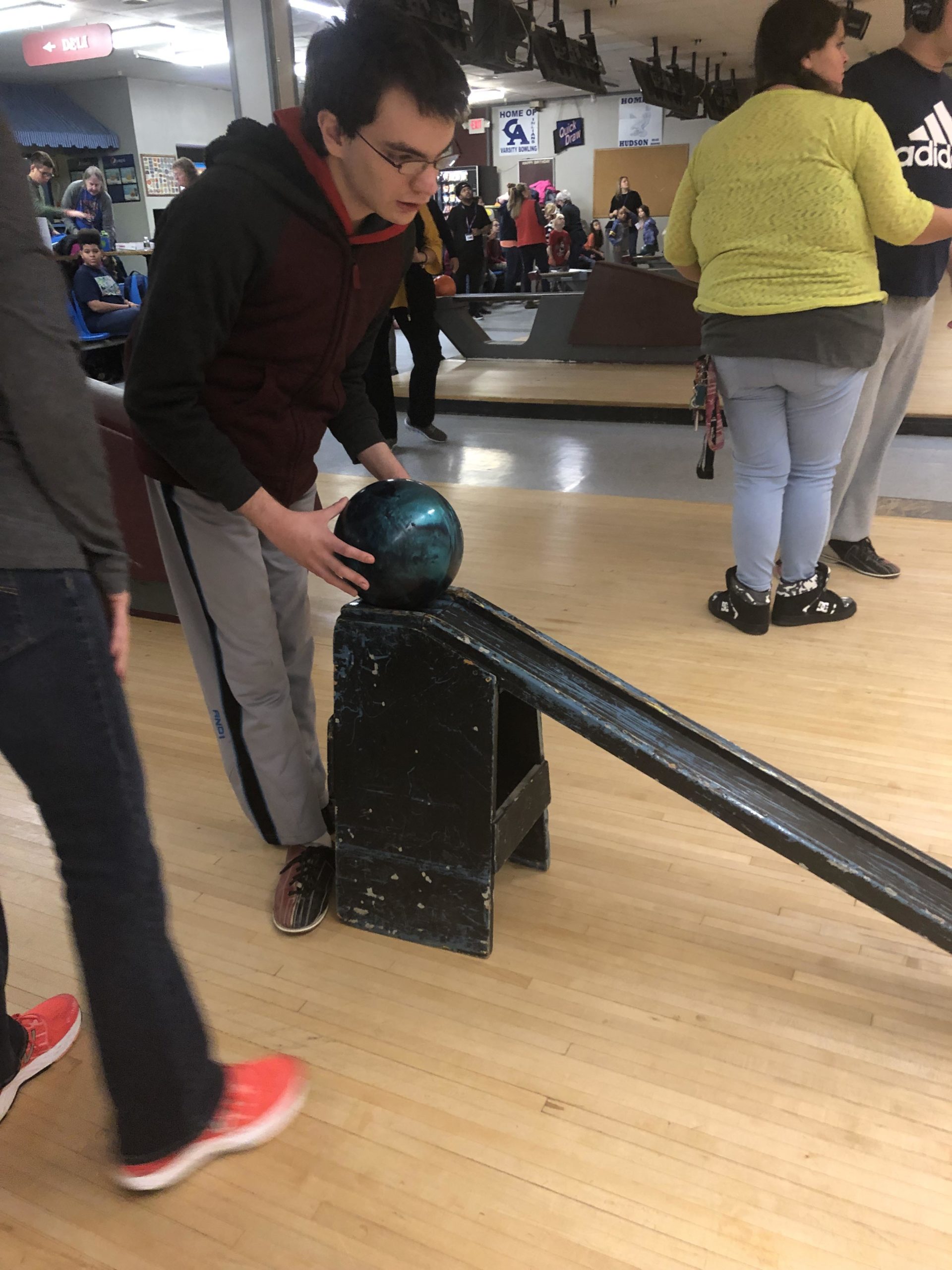 boy bowling using training ramp