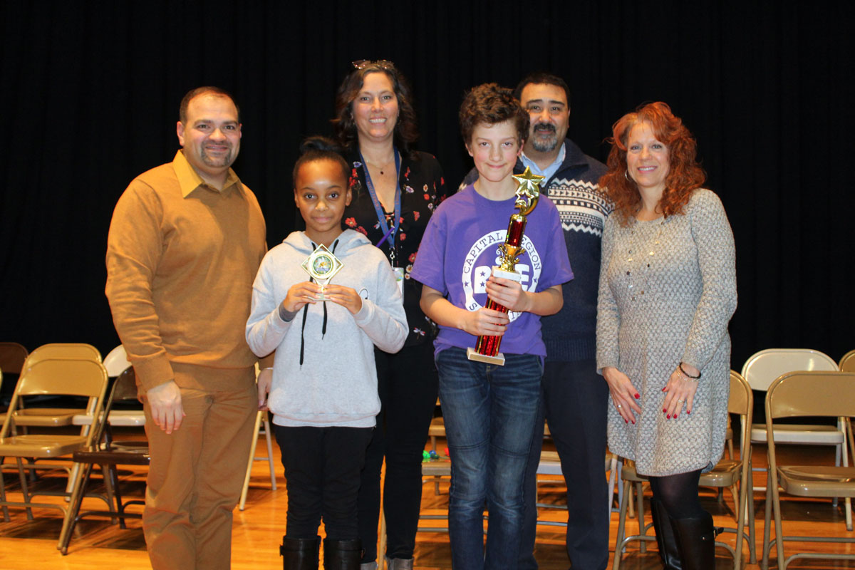 Pictured with Sam and Iana are CES Spelling Bee Committee teachers Matthew Luvera, Alexandra Standish and Heather Schindler, and Principal John Rivers.
