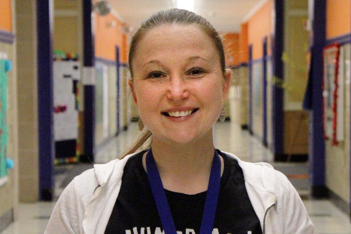 Cheryl Cinatti smiling in hallway