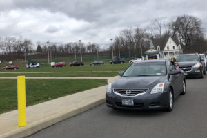 cars lined up in front of Middle School
