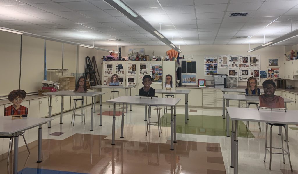 cut outs of students at desks