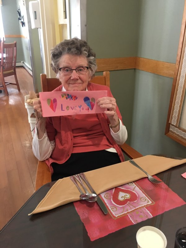 woman holding up Valentine Card
