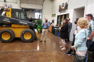 Staff visits heavy equipment maintenance facility facility