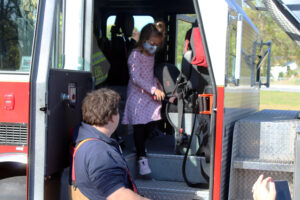 students in fire truck cab