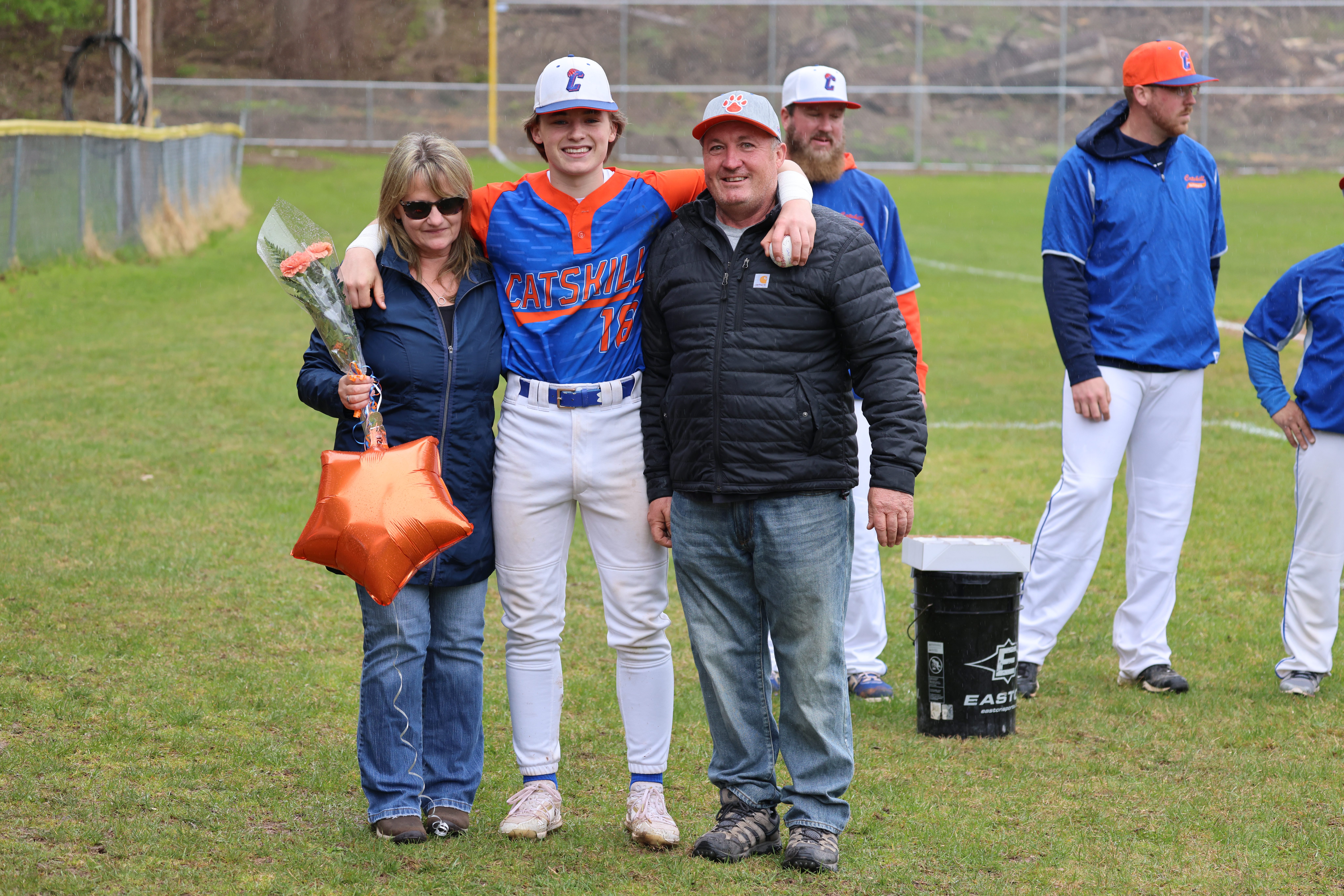 baseball player with parents
