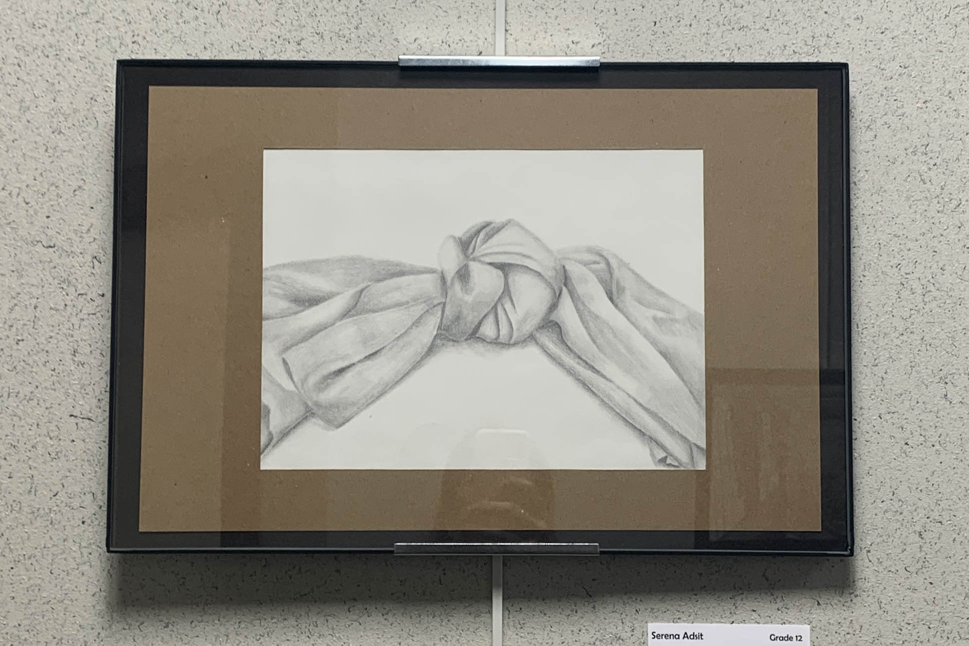 pencil drawing of scarf tied in knot