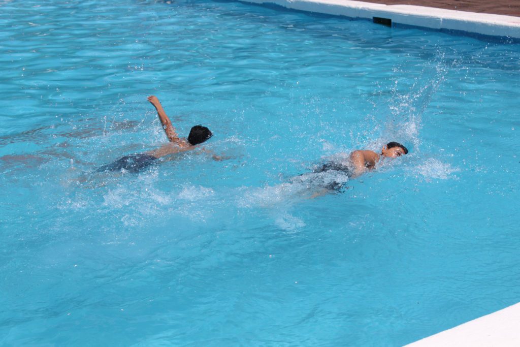 two boys swimming
