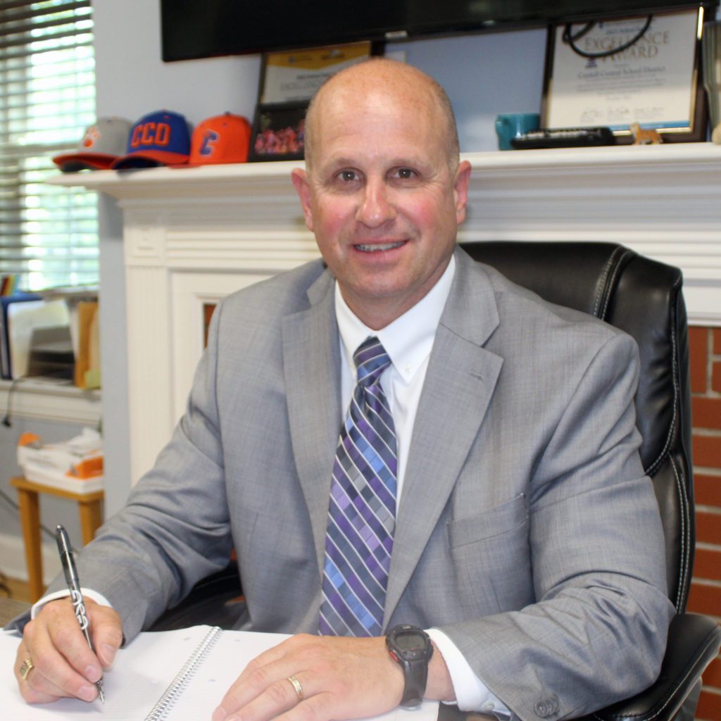 Thomas Bonjiovi sitting at desk