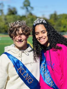 boy and girl wearing crowns and king and queen sashes