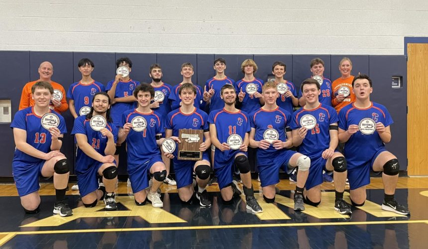 boys volleyball team with section 2 trophies