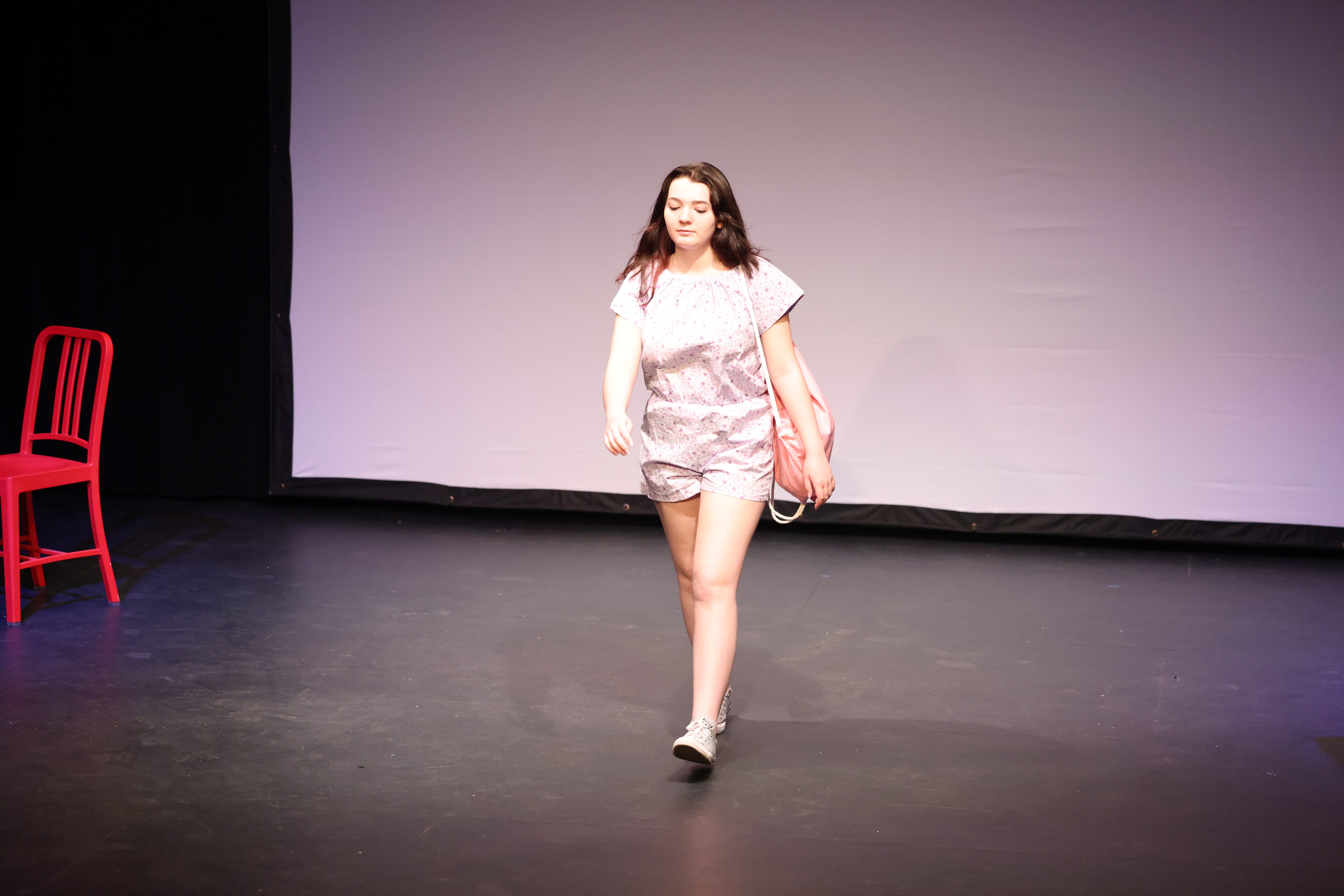 girl modeling clothes on catwalk