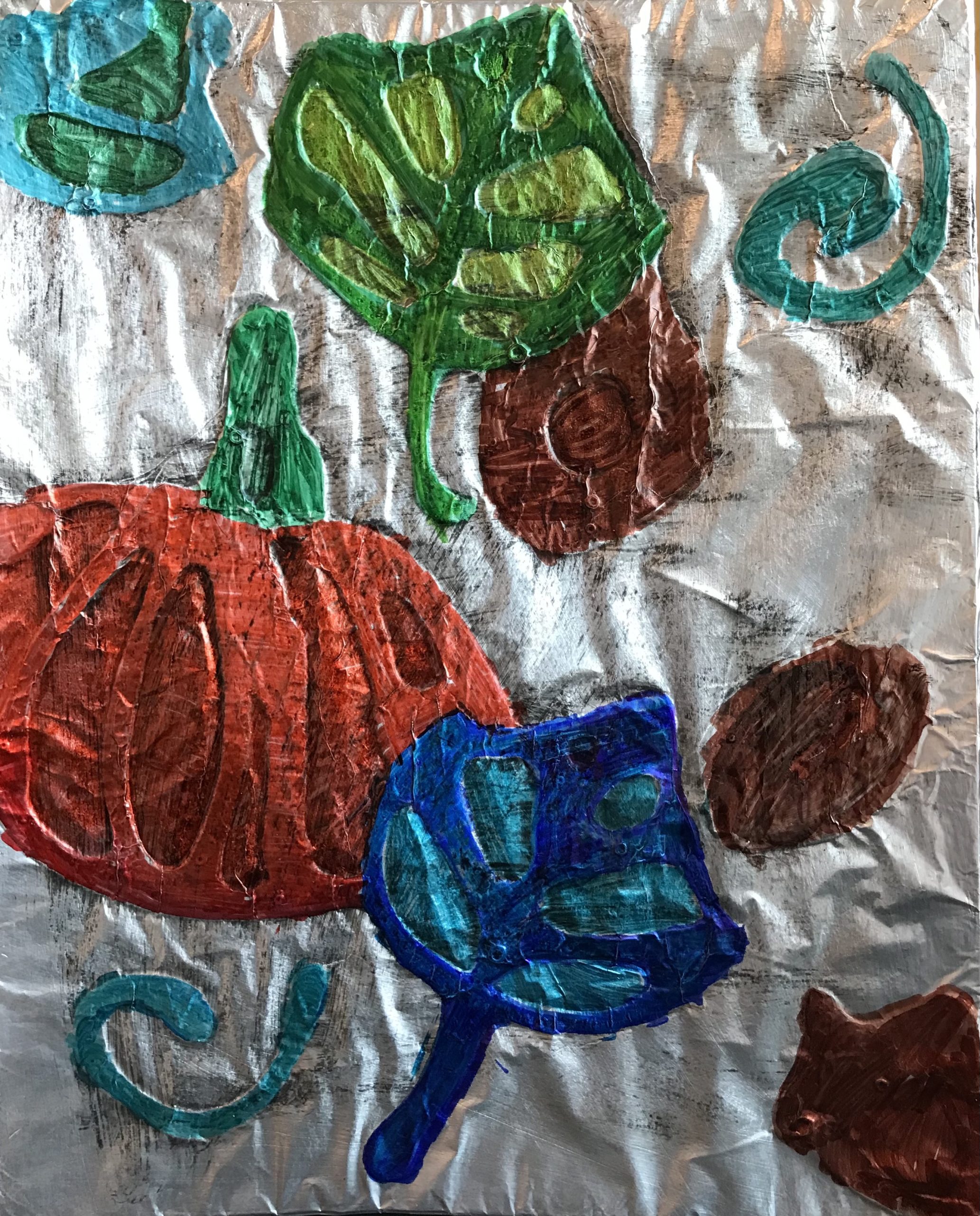 elementary school artwork depicting pumpkin and fall leaves