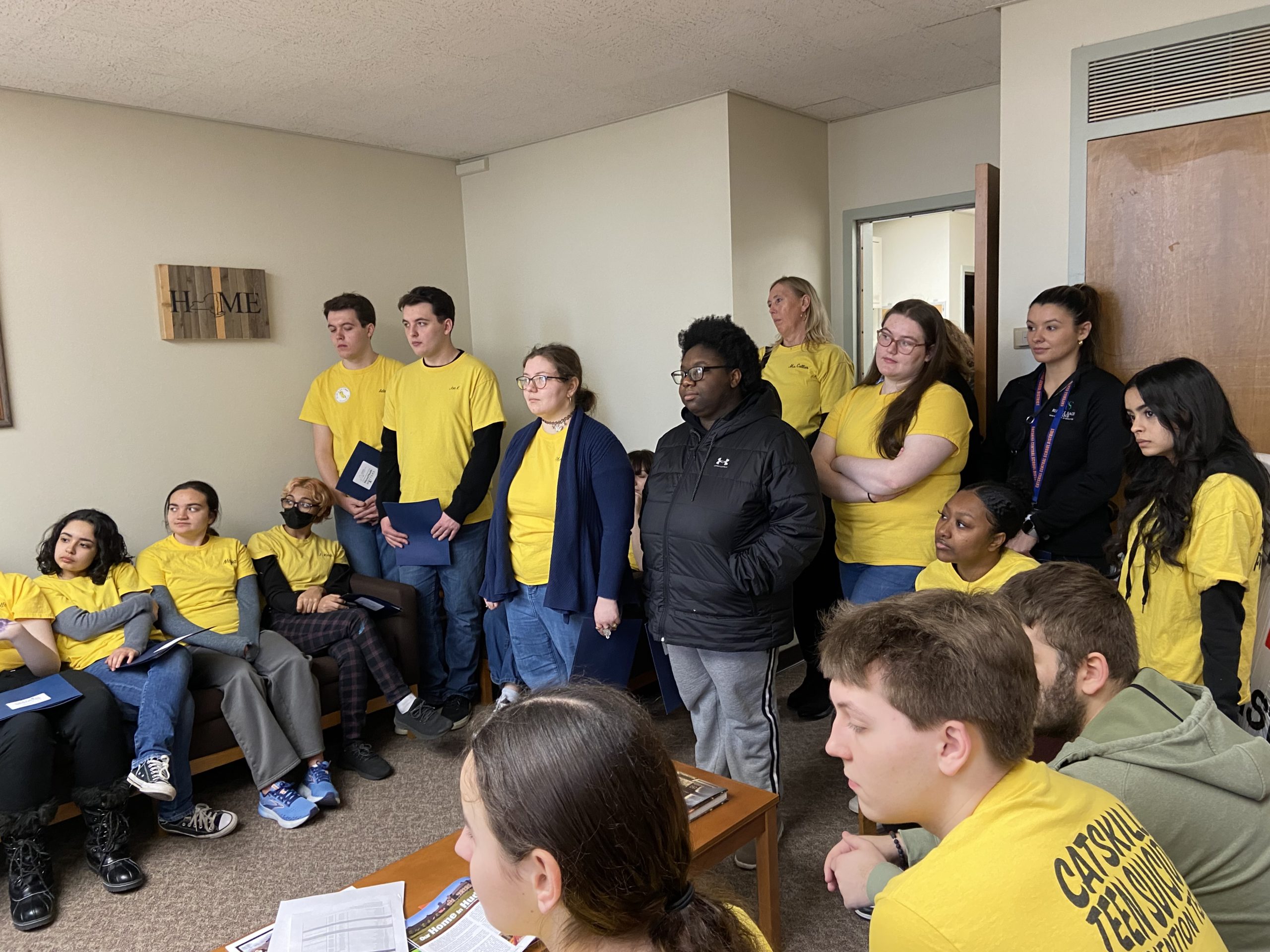 students in yellow shirts in assemblyman Chis Tague's office