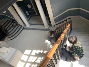 student sketching in stairwell