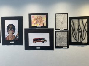 student artwork on gallery wall