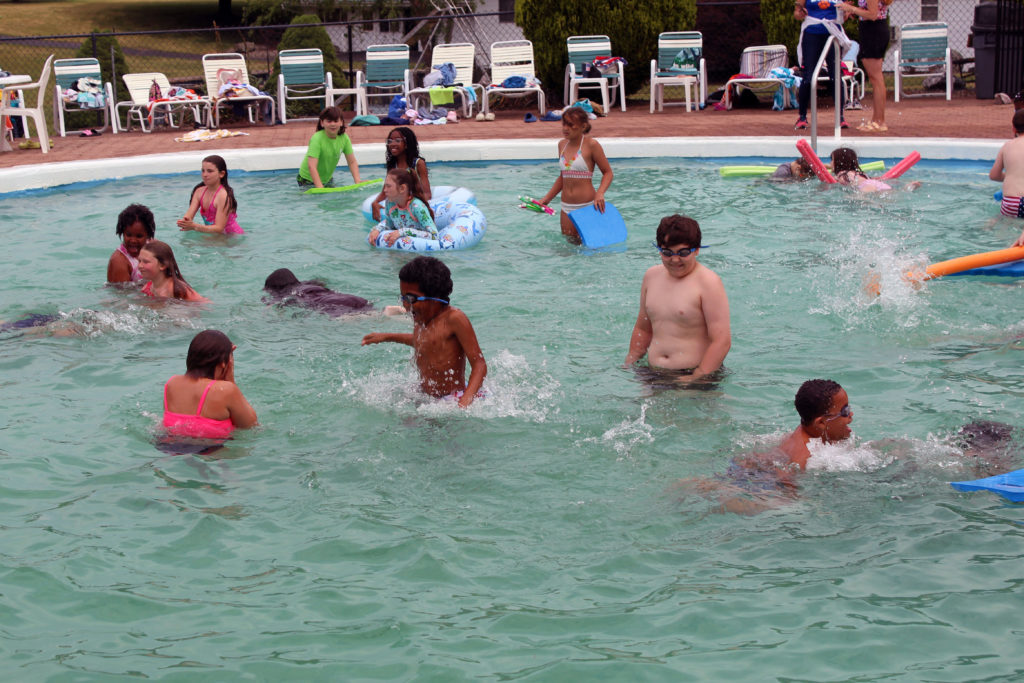students swimming in pool