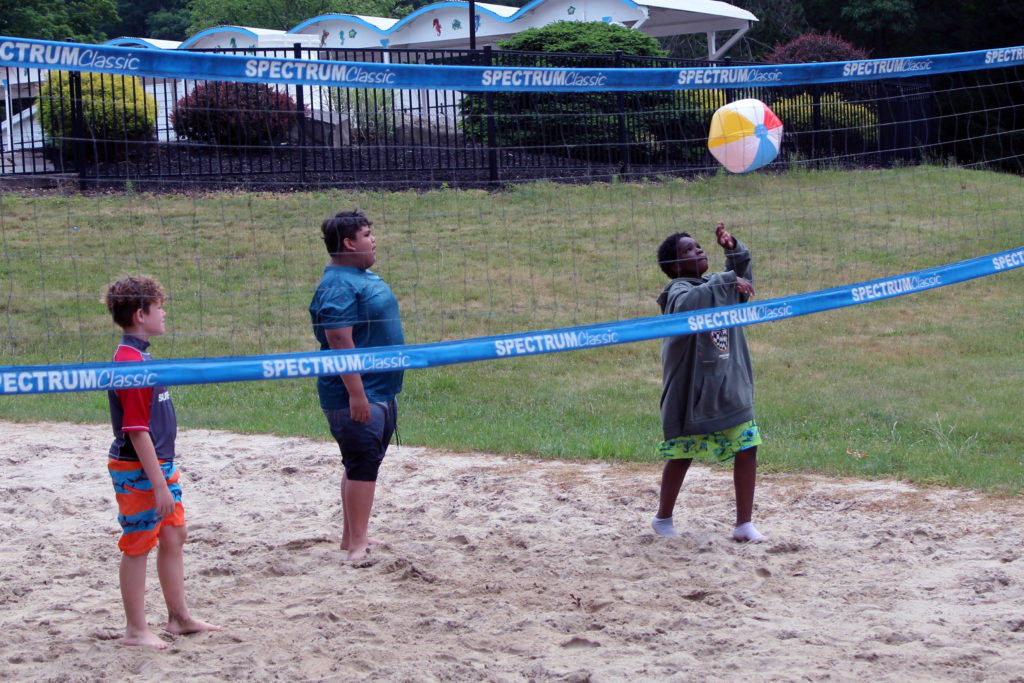 boys playing volleyball