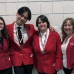 three students and woman wearing red FCCLA blazers