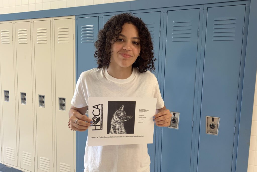 boy holding drawing