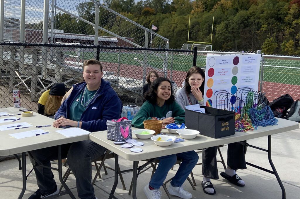 students sitting at registration table
