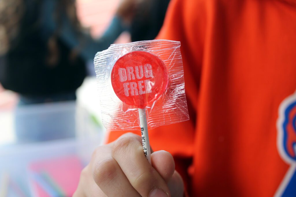 red lollipop tat says drug free