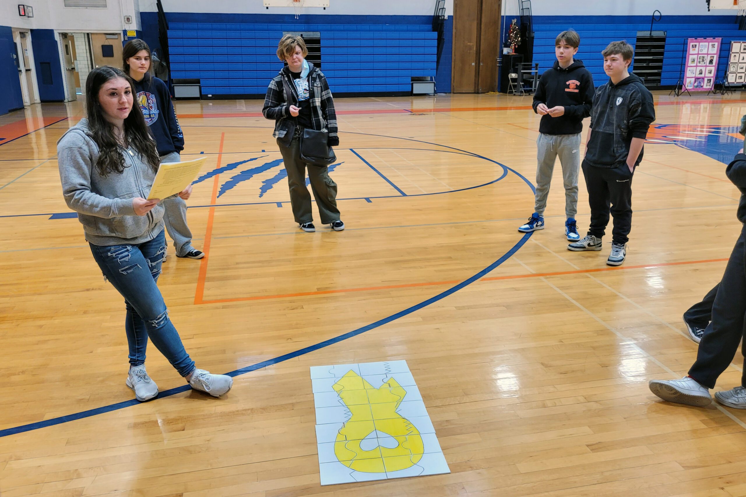 student talking to group of students