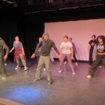students and professional dancers in dance workshop