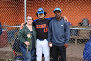baseball player posing with family